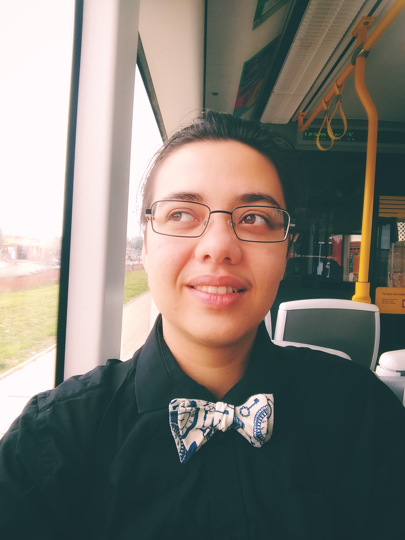 A young man with glasses and a bowtie.